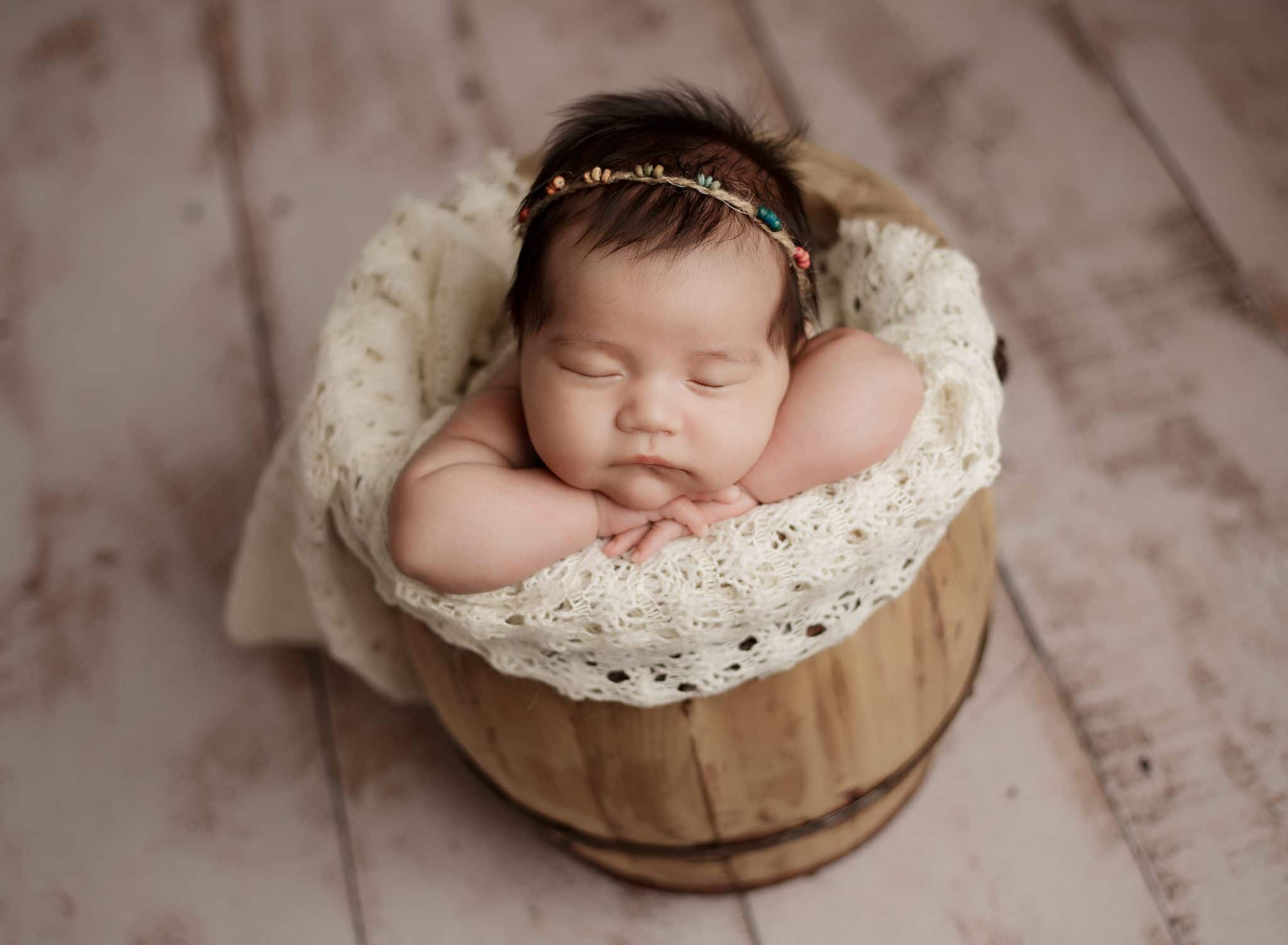 most popular newborn poses baby in posed in bucket