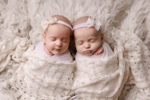 most popular newborn poses with swaddled baby