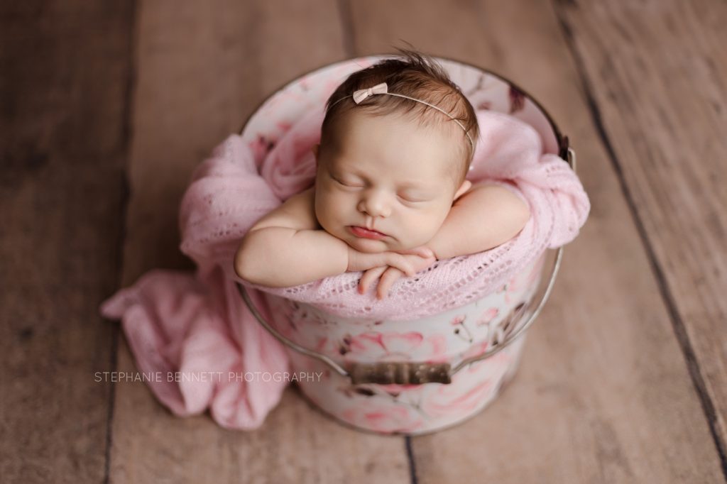 most popular newborn poses baby in posed in bucket